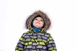 smiling child walking in snowy winter photo