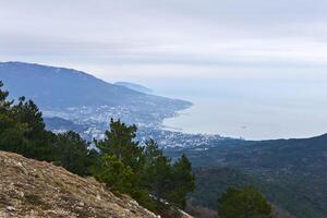 view of the seaside city of Yalta from Mount Ai-Petri in Crimea in winter photo