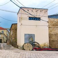 repair of a transformer box in a historic area with old houses photo