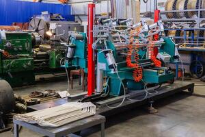 interior of an electric motor repair workshop with new and old equipment photo