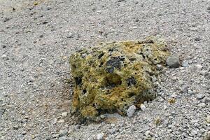 volcanic bomb among the tephra on the slope of the volcano close-up photo