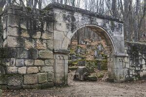 stone arch - gate at the entrance to the ancient Karaite cemetery in Bakhchisarai, Crimea photo