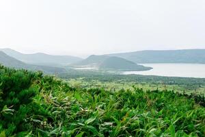 natural landscape of Kunashir island, view of the Golovnin volcano caldera with hot lakes photo