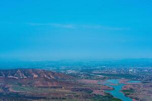 aerial view of the foothills of the Caucasus with a view of the valley of the Sulak River and the towns below on the plain photo