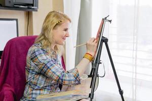 smiling woman painter at work photo