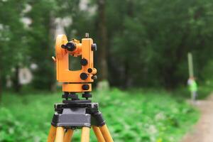 modern theodolite during use close-up on blurred background outdoors photo