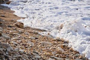 surf on a limestone beach close up photo