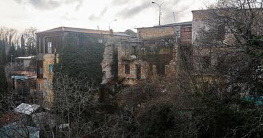 dilapidated house where people continue to live photo