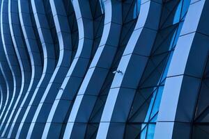 element of contemporary architecture - a fragment of the intricately curved facade of a modern building photo