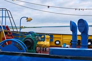 forecastle of a small river tug with various equipment photo