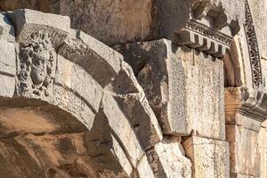 fragment of ruins of an ancient greek building antique amphitheater in Myra, now Demre, Turkey photo