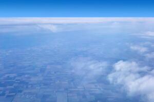 view to the earth from the height of the flight of a passenger plane photo