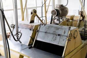 fragment of an old conche machine in the shop of a confectionery factory photo