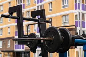 public weight machine close-up in the yard of a modern residential building photo