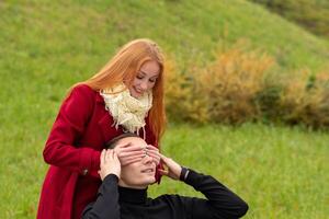 guess who, girl closes her boyfriend's eyes from behind photo