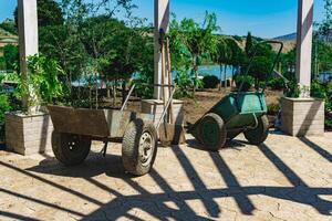 soiled wheelbarrows and shovels at landscaping photo