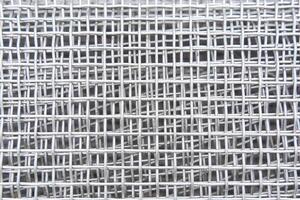 abstract background - roll of galvanized metal mesh close up photo