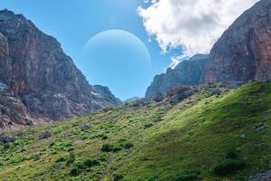 fictional landscape of some earth-like exoplanet with a huge satellite in the sky photo