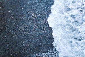 surf on a pebble beach, top view photo