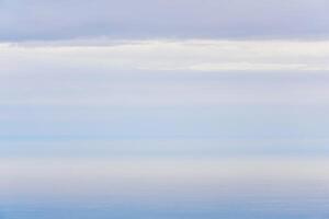 natural background, morning seascape in the gentle dawn mist photo