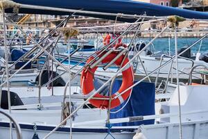 background - various pleasure and recreational fishing boats in the harbor photo