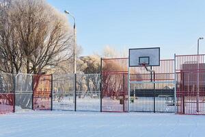 public outdoor basketball court on a frosty winter day photo