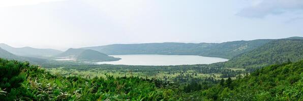 natural landscape of Kunashir island, view of the Golovnin volcano caldera with hot lakes photo