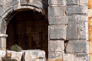 ruins of the amphitheater walls in the ancient city of Myra, Turkey photo