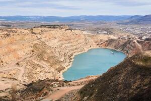 old stone quarry converted into a water reservoir for agricultural needs in Crimea photo