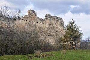 dilapidated wall of the medieval fortress Chufut-Kale, Crimea photo