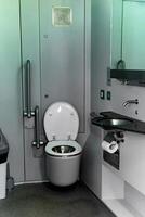 toilet interior in commuter train car photo