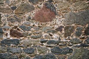 background, texture - ancient masonry at the wall of the castle photo