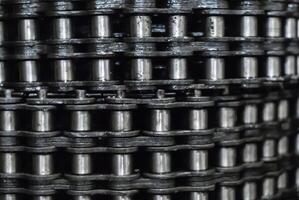 industrial background - rolled up drive chains in stock photo