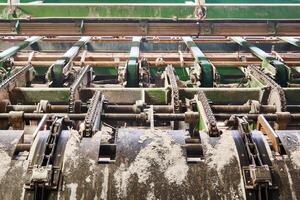 feeder of a line of sawmill equipment inside a modern lumber mill photo