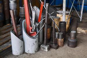 fragment of the workshop interior with details of drilling equipment and various tools photo