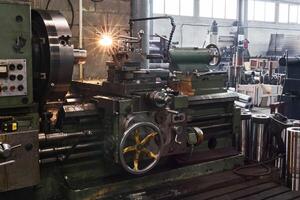 fragment of the factory hall with a lathe in the foreground photo