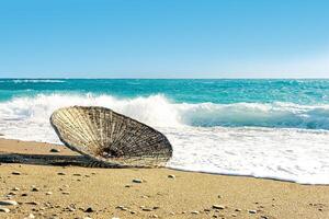 beach parasol in the surf, blown away by the wind during a storm photo