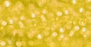 abstract blurred yellow background with sun glare photo