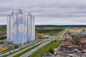 spur route leads out of the city through a suburban and commuter areas in Perm, Russia photo