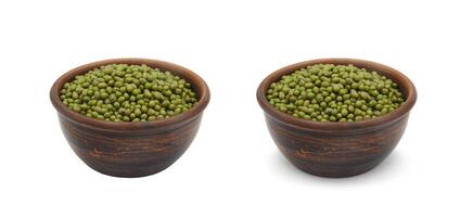 mung beans in clay bowl on white background, isolated and with shadow photo