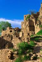 ruins of walls of houses on a cliff in the abandoned village of Gamsutl photo