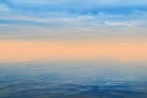 background - dawn haze over the sea in gentle colors photo