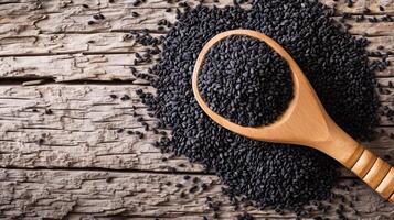 AI generated Heap of black Sesame seeds in wooden spoon on old wooden background.Top view. photo