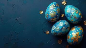 AI generated Beautiful painted blue easter eggs with golden decorations on dark blue table top view, greeting card, banner format. photo