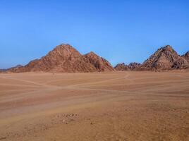 The beautiful Egyptian Sinai Peninsula with yellow sand, desert, plateaus and high and magnificent mountains, which is located on the borders with Palestine and Gaza, which contains the Suez Canal photo