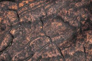 Brown rock texture in top view serves as a unique and captivating.  Nature from top of hill. photo