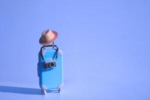Fully opened blue suitcase, on a blue background, top view. Vacation, travel concept. copy space photo