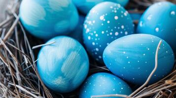 ai generado azul pintado Pascua de Resurrección huevos son pulcramente arreglado en un nido. Perfecto para con tema de Pascua diseños y decoraciones foto