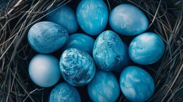 AI generated Blue painted Easter eggs are neatly arranged in a nest. Perfect for Easter-themed designs and decorations photo