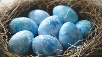 AI generated Blue painted Easter eggs are neatly arranged in a nest. Perfect for Easter-themed designs and decorations photo